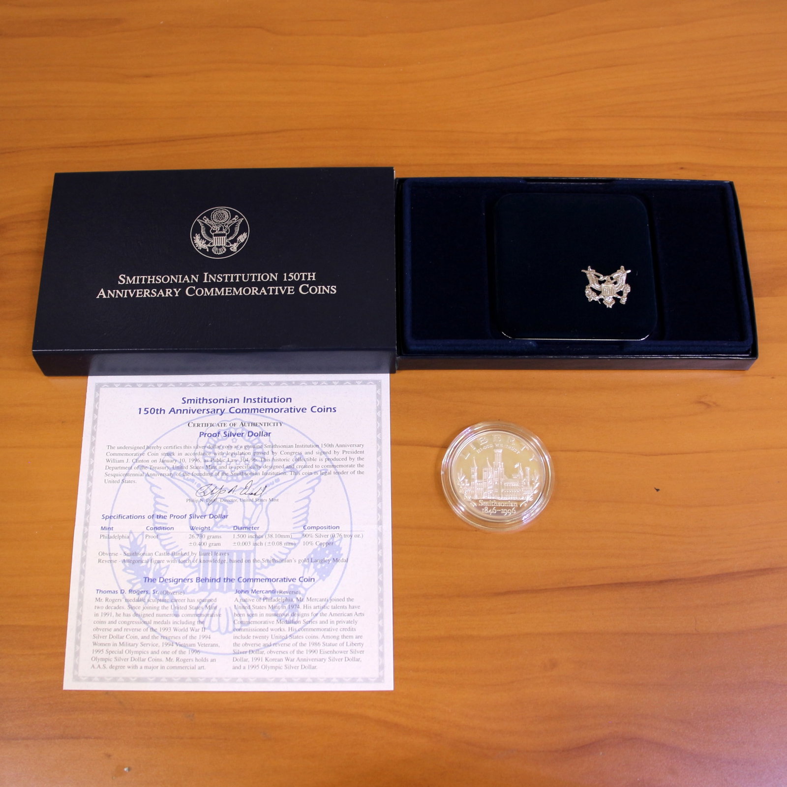 US Mint Smithsonian Institution 150th Anniversary Silver Dollar Proof Coin OGP: Contains one 1846-1996 United States Mint 90% Silver Commemorative Silver Dollar. Set in original packaging and contains certificate of authenticity.