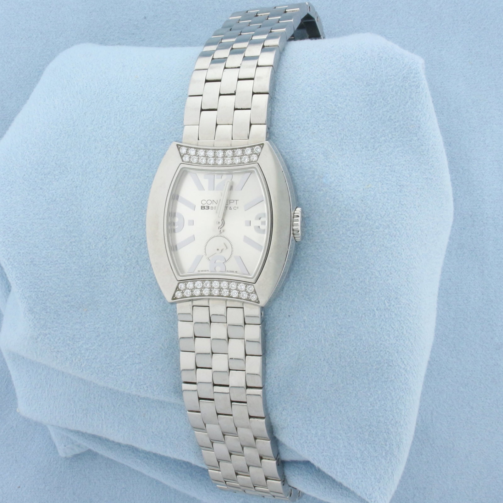 Ladies Bedat & Co. Concept B3 Steel And Diamond Watch CBO3: Ladies Bedat & Co model CB03 CONCEPT features a Tonneau/Barrel 32x29 mm Stainless Steel Case. Complimented by a Silver Guilloched dial and Diamond Bezel. Fitted on a Stainless Steel Bracelet with a