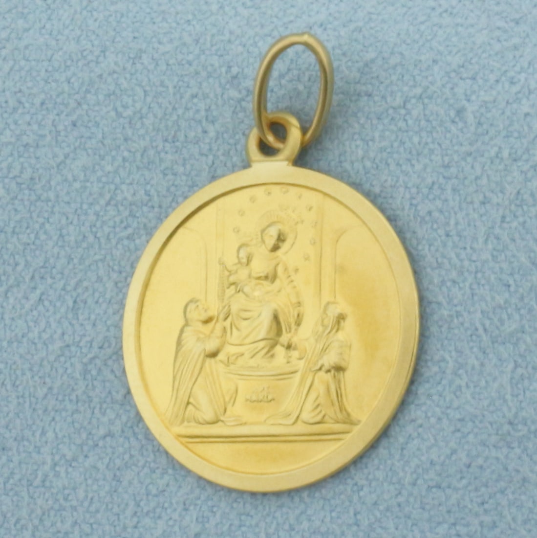 Ave Maria Virgin Mary and Jesus Christ Pendant or Charm in 18k Yellow Gold: In 18k Yellow Gold. 1 inch long (including jump ring). 3/4 inch wide. 3.2g.