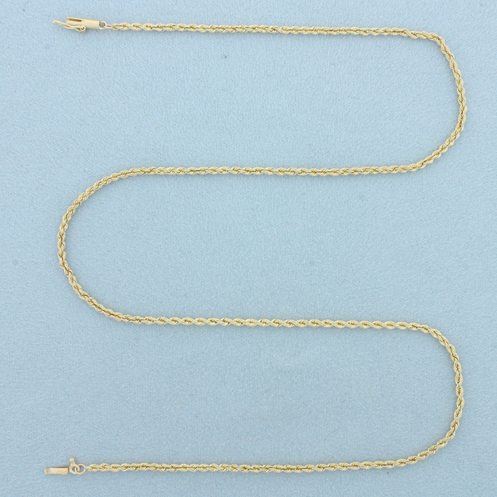 18 Inch Rope Link Chain Necklace in 14k Yellow Gold: In 14k Yellow Gold. 18 inches long. 2mm wide. Barrel clasp with safety latch. 6.0g.