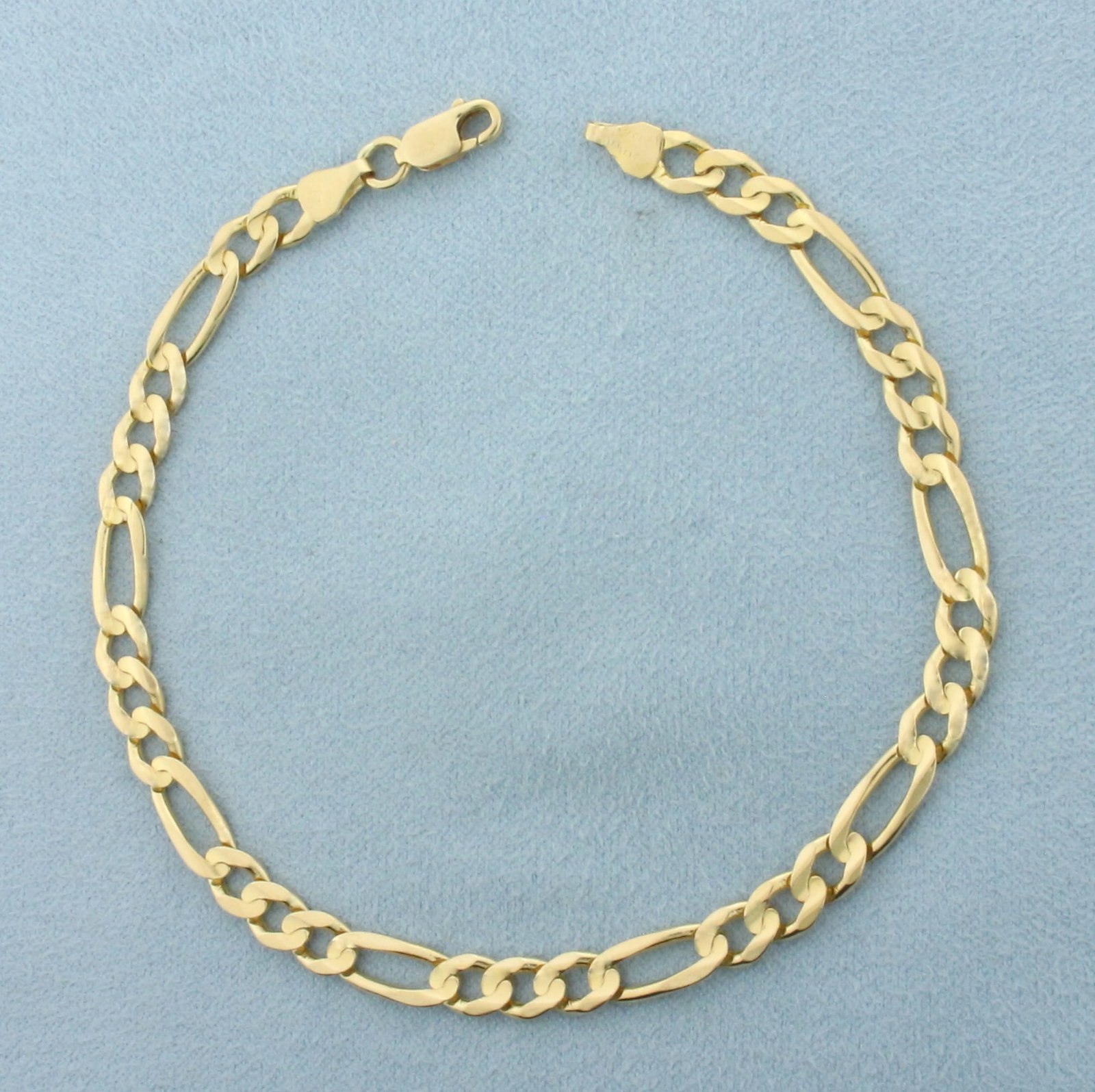 Mens Italian Figaro Bracelet in 14k Yellow Gold: In 14k Yellow Gold. 8 3/4 inches long. 5.2mm wide. Italian made. Lobster clasp. 8.2g.
