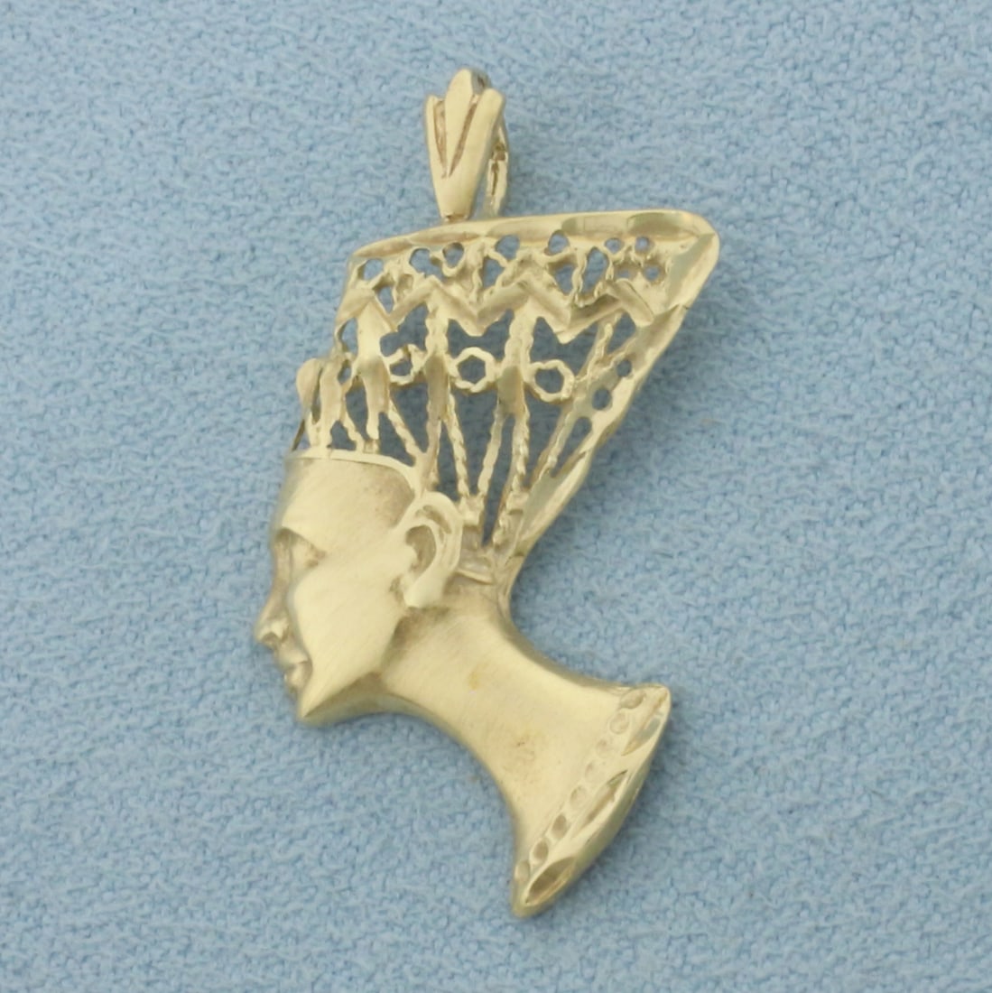 Queen Nefertiti Pendant in 14k Yellow Gold: In 14k Yellow Gold. 1 1/4 inch long (including bale). 3/4 inch wide. 1.8g.