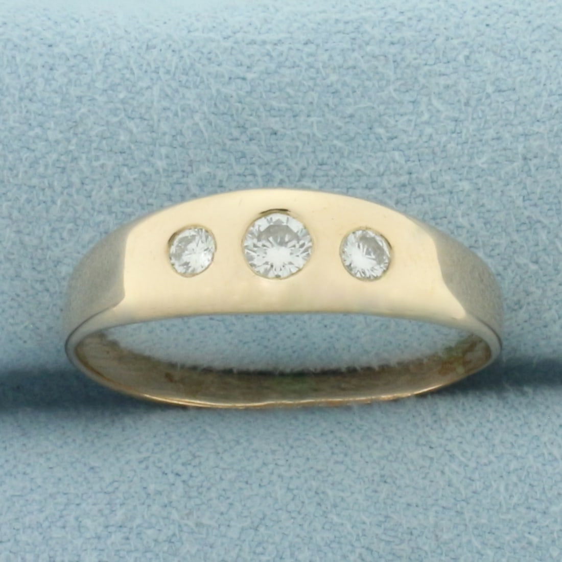 Mens 3-Stone Diamond Flush Set Wedding Ring in 14k Yellow Gold: In 14k yellow gold. 6.6mm wide at widest part. Contains one .2ct and two .1ct high quality round brilliant diamonds, VS clarity/F color. Size 11.5. 3.2g.