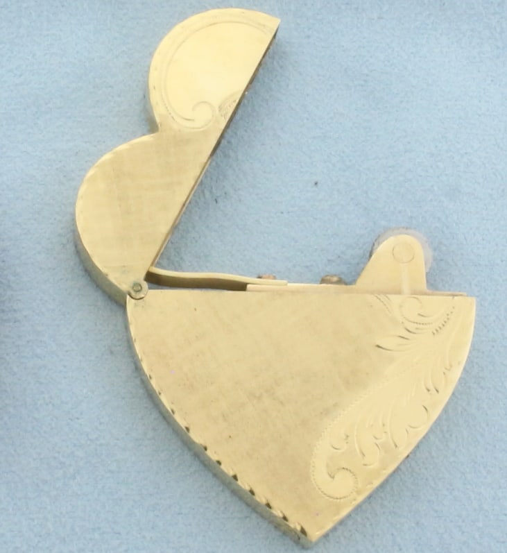 Vintage Engravable Heart Lighter with Matching Case in 14k Yellow Gold: In 14k yellow gold. 1.5 inches long by 1.6 inches wide. Engravable. Includes original red leather case. 26.6g (without case)