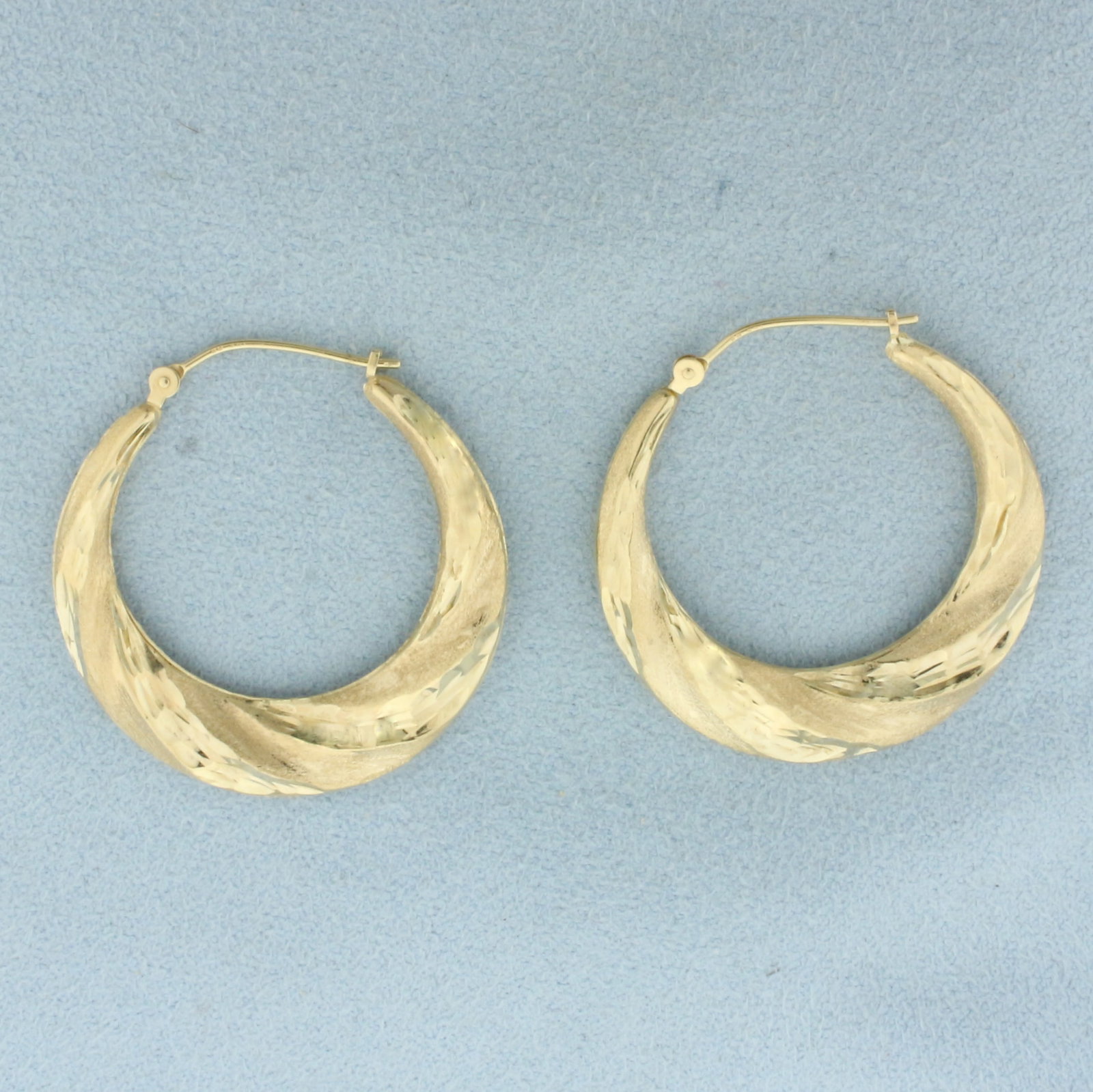 Diamond Cut Twisting Hoop Earrings in 14k Yellow Gold