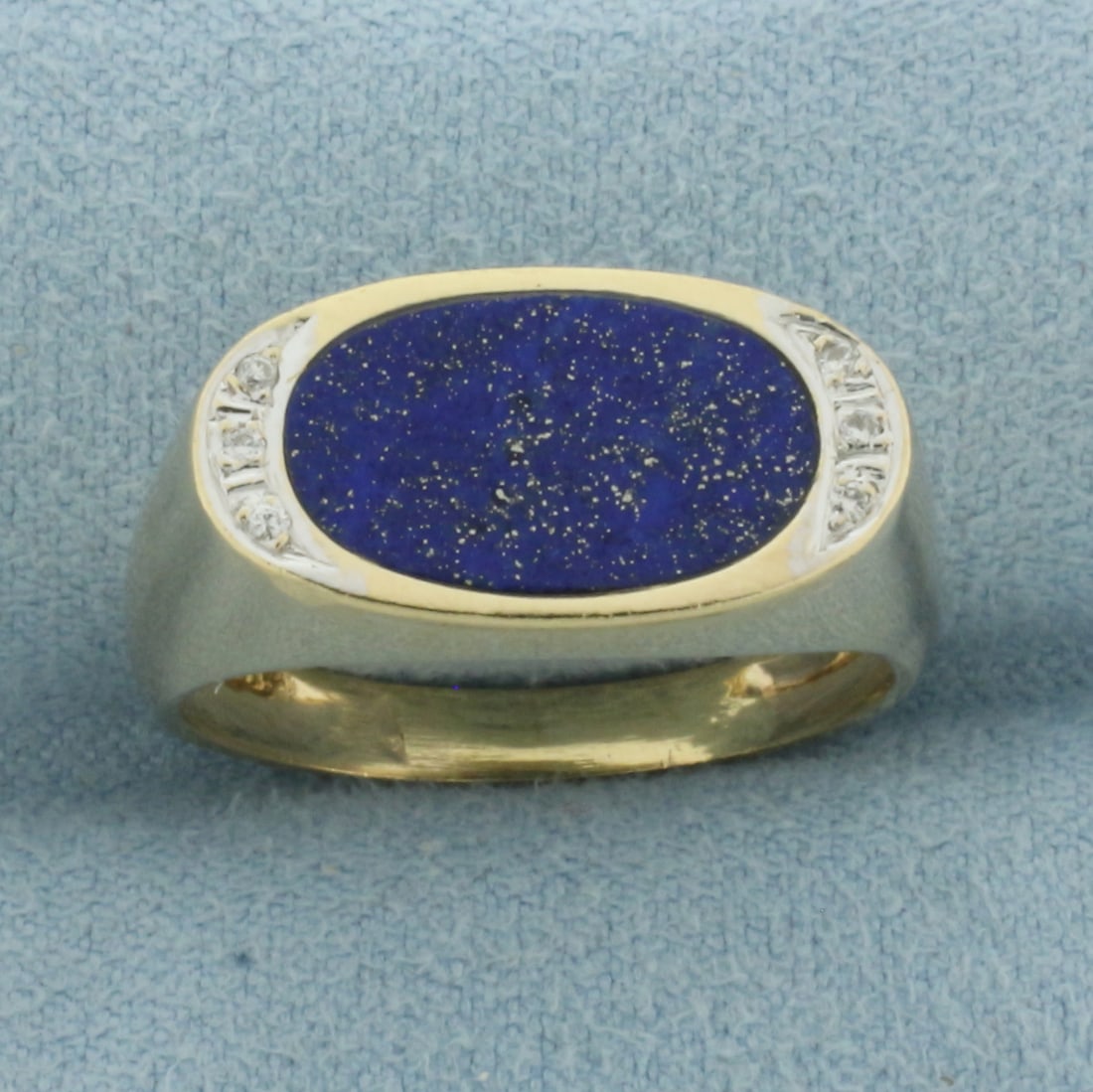 Lapis Lazuli and Diamond Ring in 14k Yellow Gold: In 14k Yellow Gold. Contains one 13.5mm high quality oval Lapis Lazuli gemstone with deep blue color and flecks of gold. Also contains six high quality 1/2pt diamonds. Size 9. 5.4g.