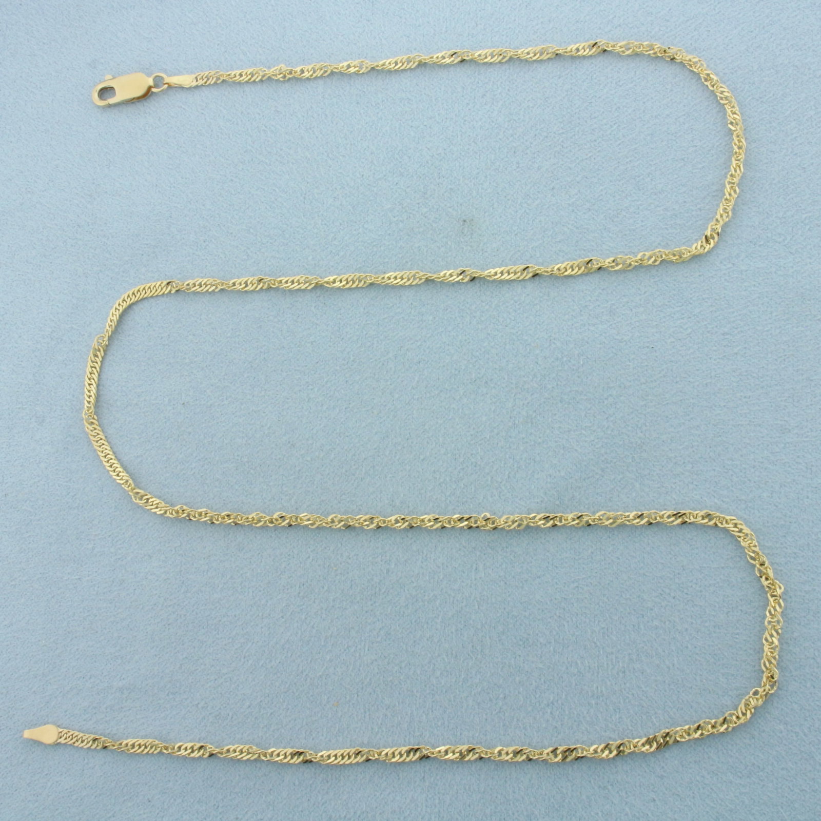 20 Inch Twisting Curb Link Chain Necklace in 14k Yellow Gold