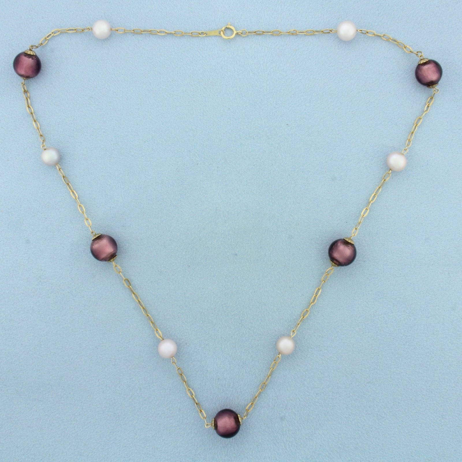 Italian Eggplant Art Glass Beads and Cultured Akoya Pearl Station Necklace in 14k Yellow Gold: In 14k Yellow Gold. Contains five 10mm high quality Italian art glass beads. Also contains six 7mm high quality Cultured Akoya Pearls with high luster. 20 inches long. 2.3mm wide chain. Italian made. 