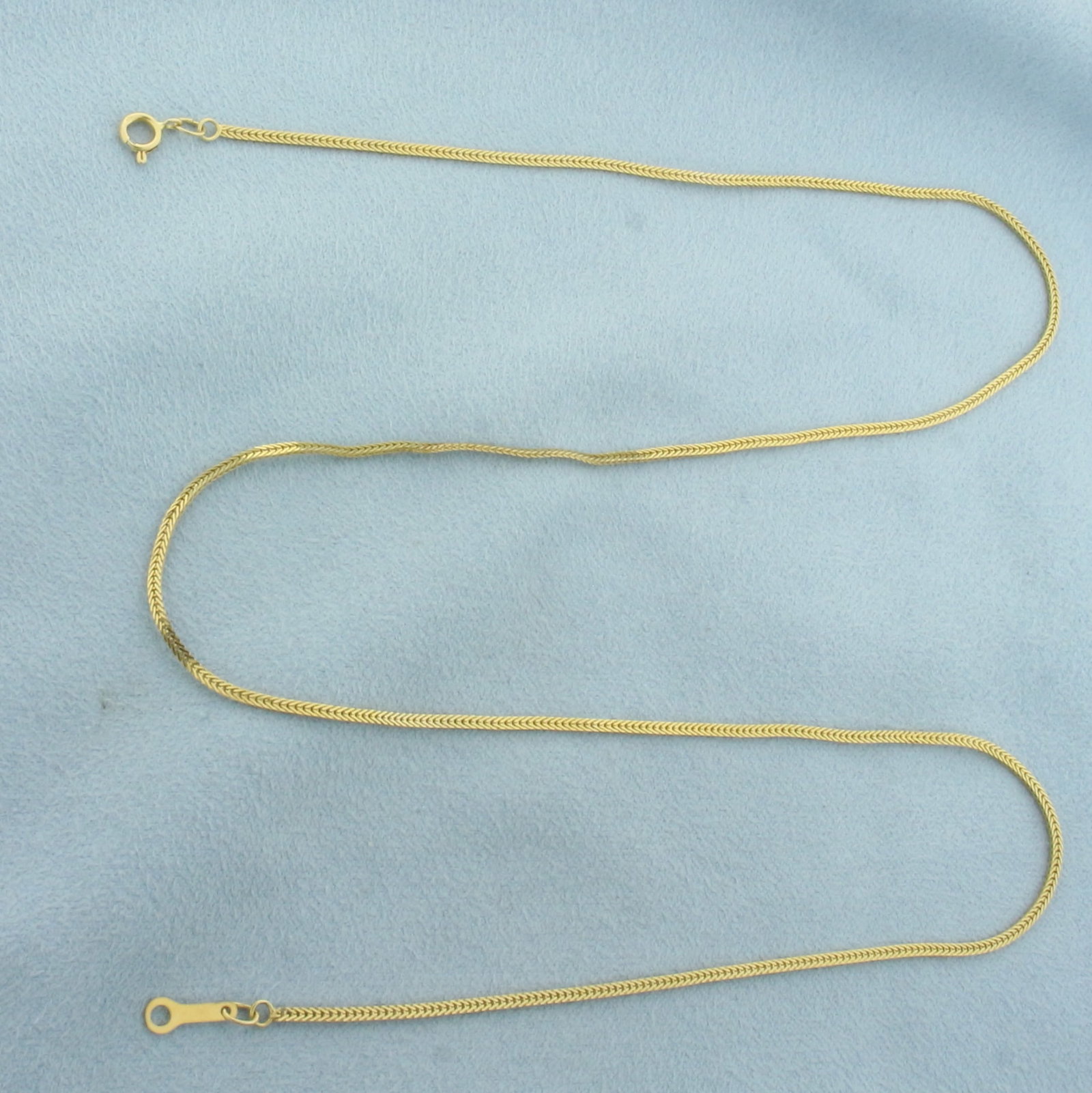 20 Inch Italian Flat Wheat Link Chain Necklace in 14k Yellow Gold: In 14k Yellow Gold. 2 inches long. 1.4mm wide. Italian made. Spring clasp. 3.2g.