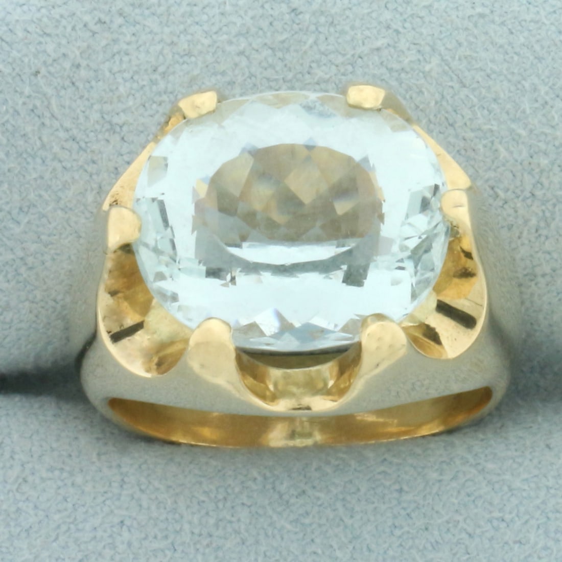 9ct Aquamarine Claw Set Statement Ring in 14k Yellow Gold: In 14k yellow gold. Contains 1 high quality natural 15mm by 13mm Aquamarine gemstone, approximately 9cts, with beautiful color and excellent clarity. Size: 9. 18.6g.