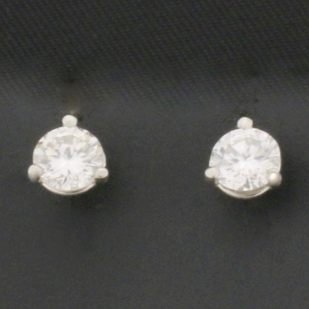 3/4ct Diamond Stud Earrings in Platinum Martini Settings: In Platinum Martini Settings. Contains two high quality natural round brilliant diamonds, 3/4ct TW, VS clarity/G color, eye clean, excellent cut for extra sparkle. In 3-prong martini settings with