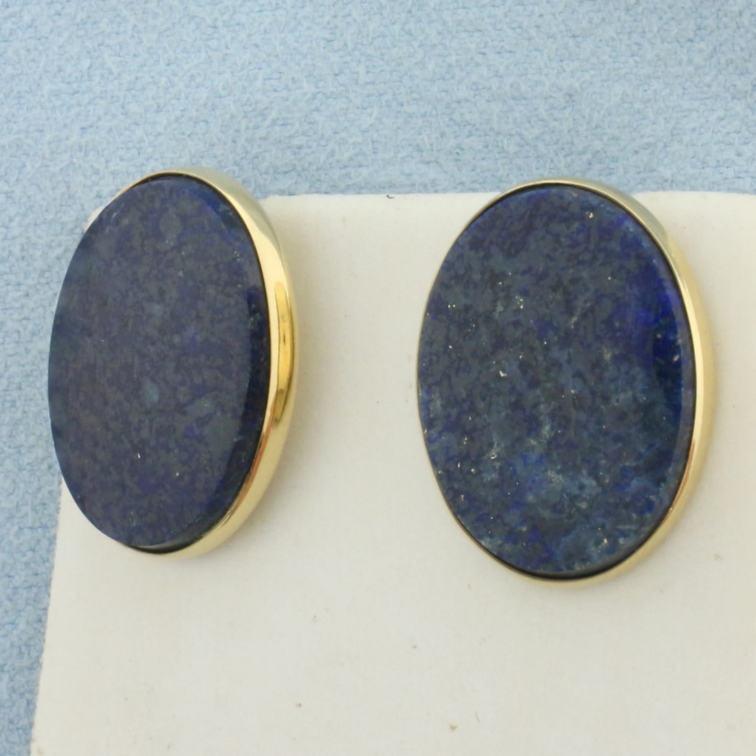 Dolan Bullock D&B Lapis Lazuli Button Earrings in 14k Yellow Gold: In 14k Yellow Gold. Contains two natural high quality 19x14mm oval lapis lazuli gemstones. Original D&B 14k yellow gold friction backs. 6.4g.