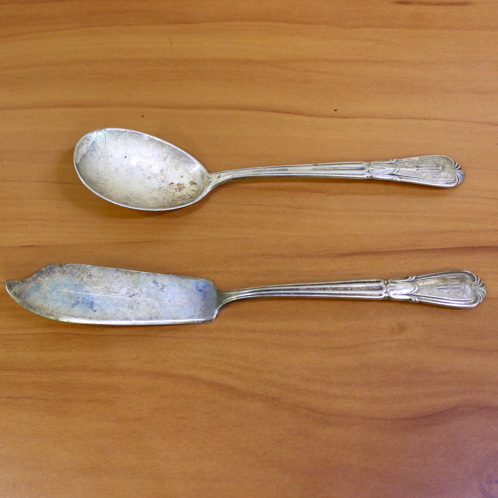Antique Simon Brothers Sterling Silver Flatware - Set of 2: In .925 Sterling Silver. Contains one sugar spoon - 6 inches, with monogram. Also contains one flat handle master butter knife - 6 7/8 inch, with monogram. 68.5g.