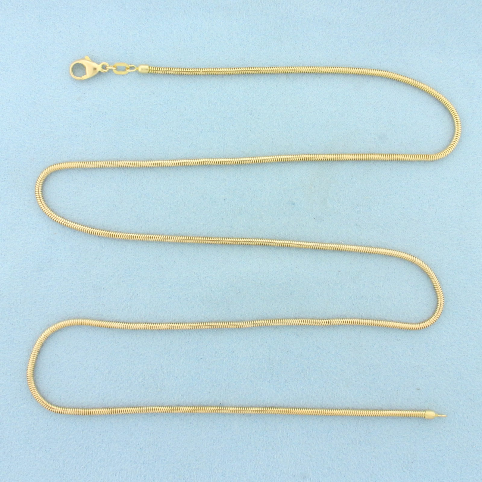 Italian 25 Inch Snake Link Chain Necklace in 14k Yellow Gold: In 14k Yellow Gold. 25 inches long. 2mm wide. Lobster clasp. 14.7g.