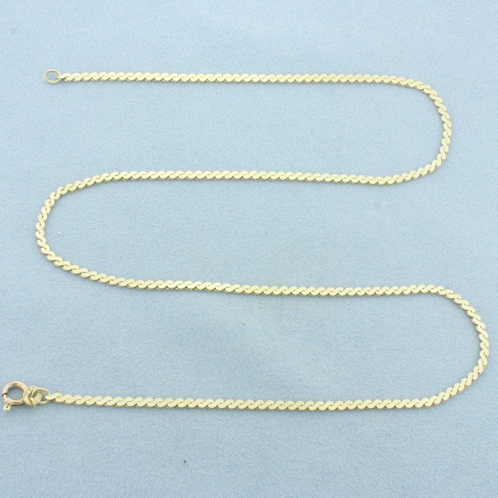Italian 18 Inch S-Link Serpentine Chain Necklace in 14k Yellow Gold: In 14k Yellow Gold. 18 inches long. 2mm wide. Spring clasp. Italian made. 7.1g.