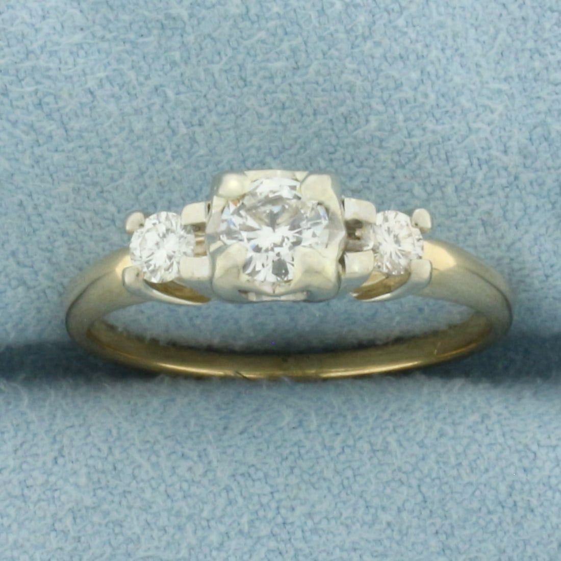 3 Stone Diamond Engagement Ring in 14k Yellow Gold: In 14k Yellow Gold. Contains one 1/3ct round brilliant diamond, H color, I clarity, eye clean, great cut for added brilliance. Also contains two 1/10 ct round brilliant diamonds of similar high qualit
