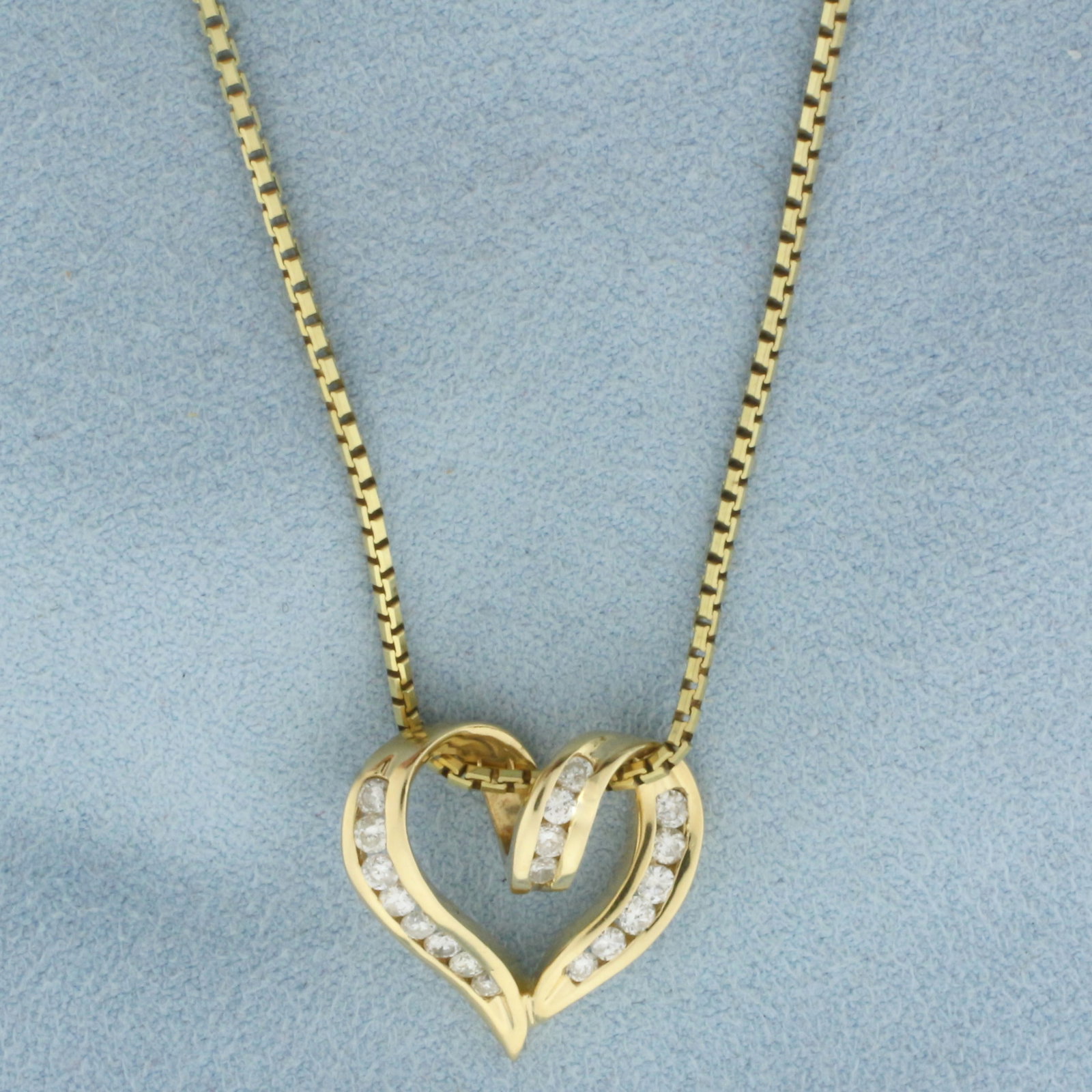 Italian Diamond Heart Necklace in 14k Yellow Gold: In 14k Yellow Gold. Contains eighteen high quality diamonds, 1/2ct TW, SI clarity/H color. 3/4 inch by 3/4 inch wide pendant. 18 inch long box link chain, 1.3mm wide. Italian made. 8.5g.