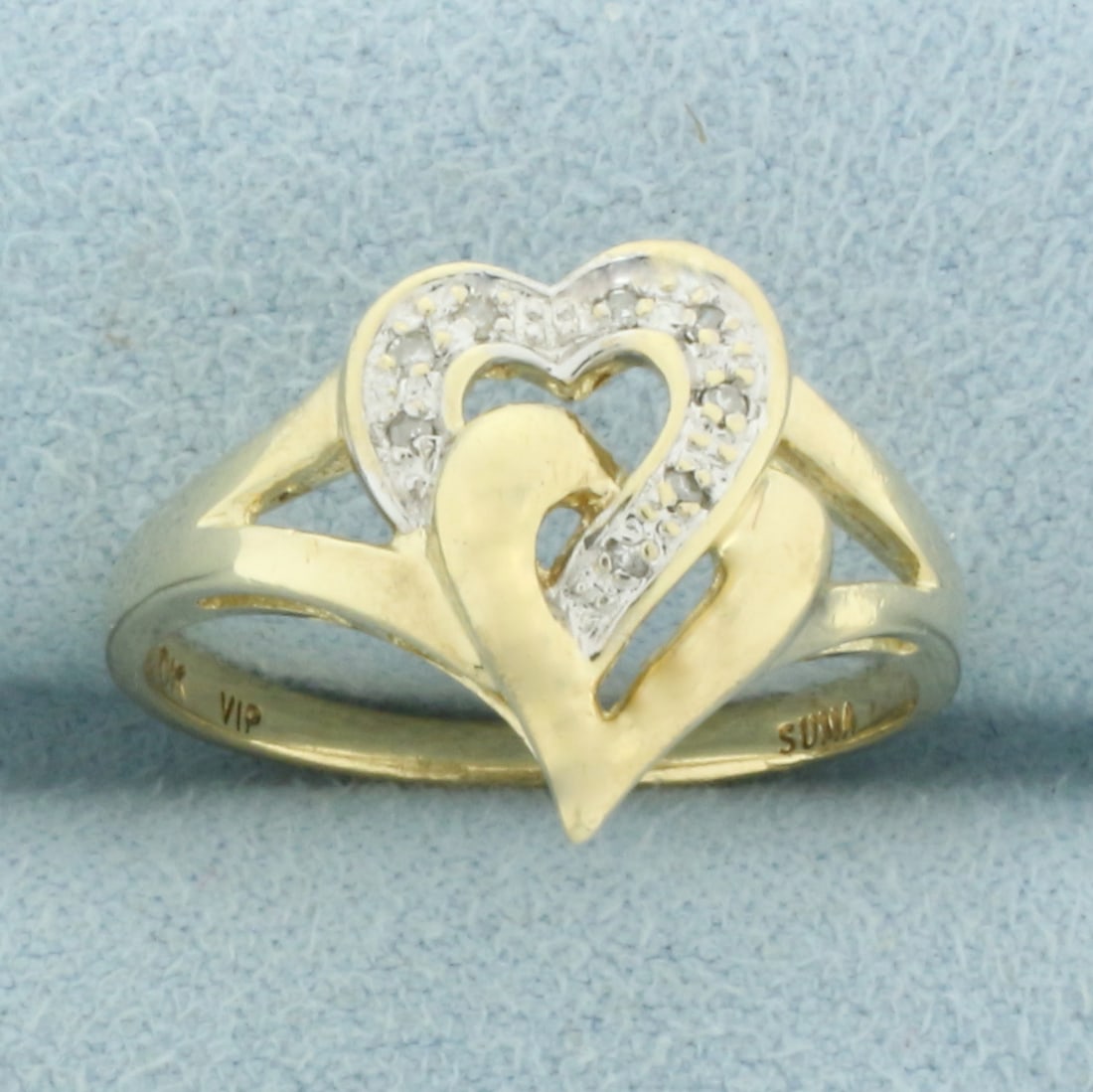 Diamond Lovers Heart Ring in 10k Yellow Gold: In 10k Yellow Gold. Contains eight high quality 1/2pt diamonds. 13.4mm wide at center. Size 6. 2.6g.