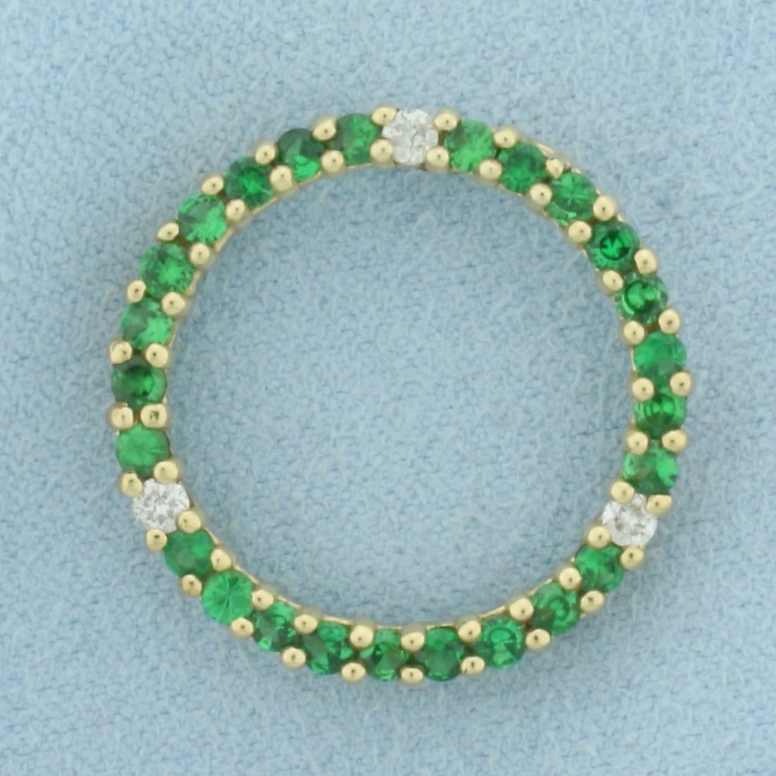 Green Garnet and Diamond Circle Pendant in 10k Yellow Gold: In 10k yellow gold. 7/8" diameter. Contains twenty-five 2mm high quality natural garnet gemstones with vibrant color and excellent clarity. Also contains three .04ct diamonds, H color/I clarity. 2.4g