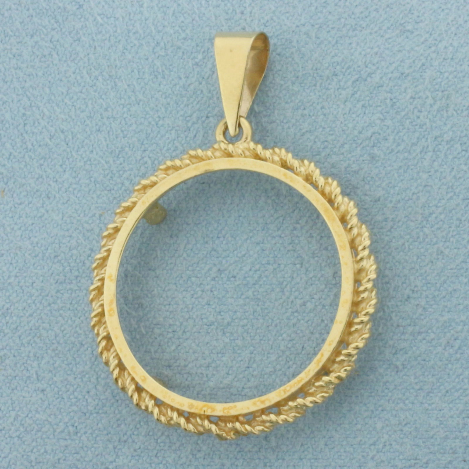 29MM Coin Bezel Pendant in 14k Yellow Gold: In 14k Yellow Gold. 1 3/8 inch long. 1 inch diameter. Fits any 29mm coin like 1/2oz Gold Eagle. 2.9g.