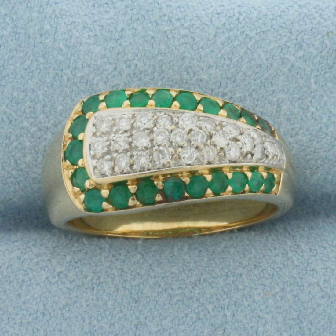 Emerald and Diamond Modern Design Ring in 14K Yellow Gold: In 14k yellow gold. Measures 11mm wide at top of ring. Contains 21 high quality 1.75 to 2.5mm Emerald gemstones with bright color and excellent clarity. Also contains 26 high quality .01ct diamonds, S