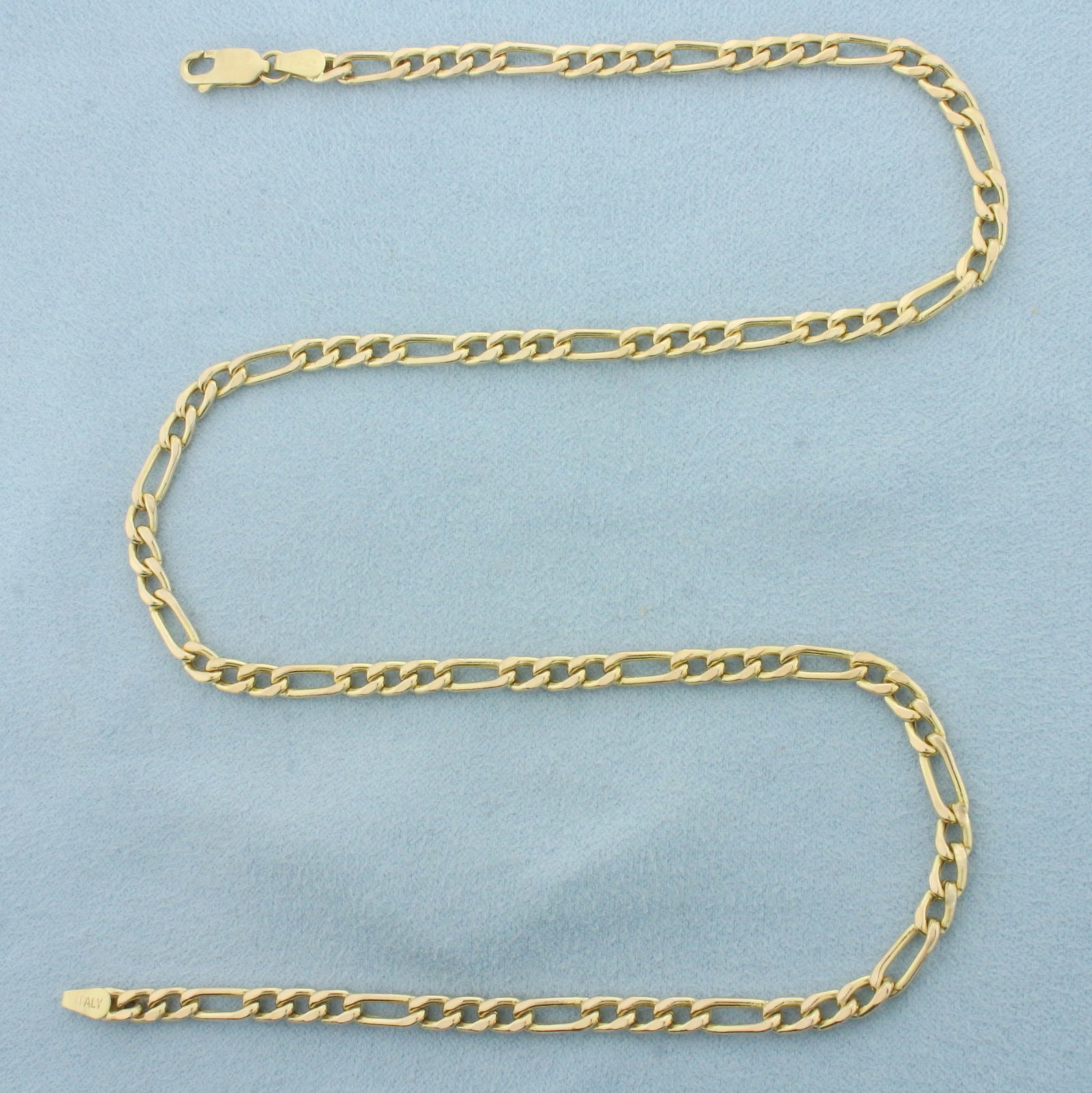 18 Inch Italian Figaro Link Chain Necklace in 14k Yellow Gold: In 14k Yellow Gold. 18 inches long. 3.9mm wide. Italian made. Lobster clasp. 9.6g.