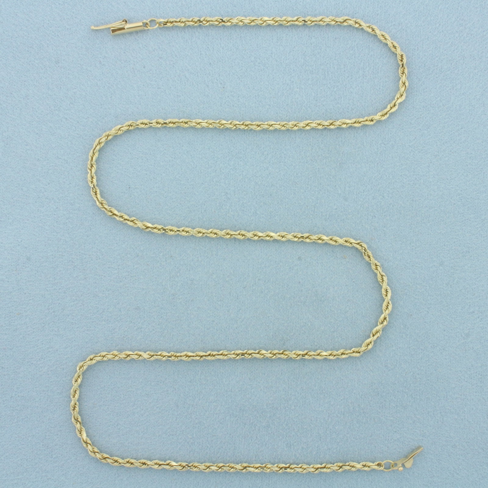 18 Inch Rope Link Chain Necklace in 10k Yellow Gold: In 10k Yellow Gold. 18 inches long. 2.1mm wide. Barrel clasp with safety latch. 7.9g.