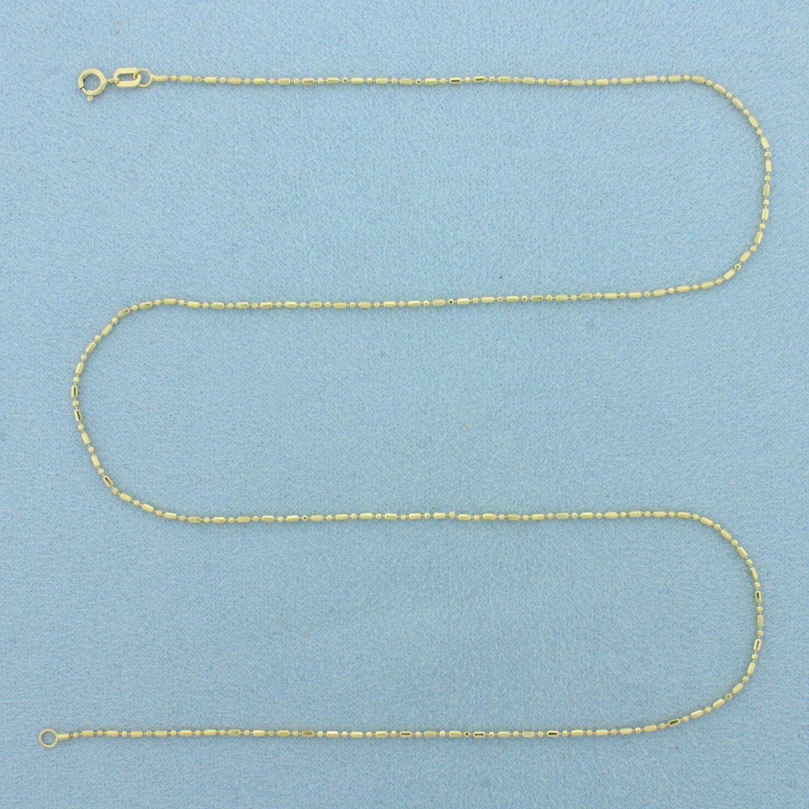 18 Inch Bar and Bead Link Chain Necklace in 14k Yellow Gold: In 14k Yellow Gold. 18 inches long. 1mm wide. Spring clasp. 1.7g.