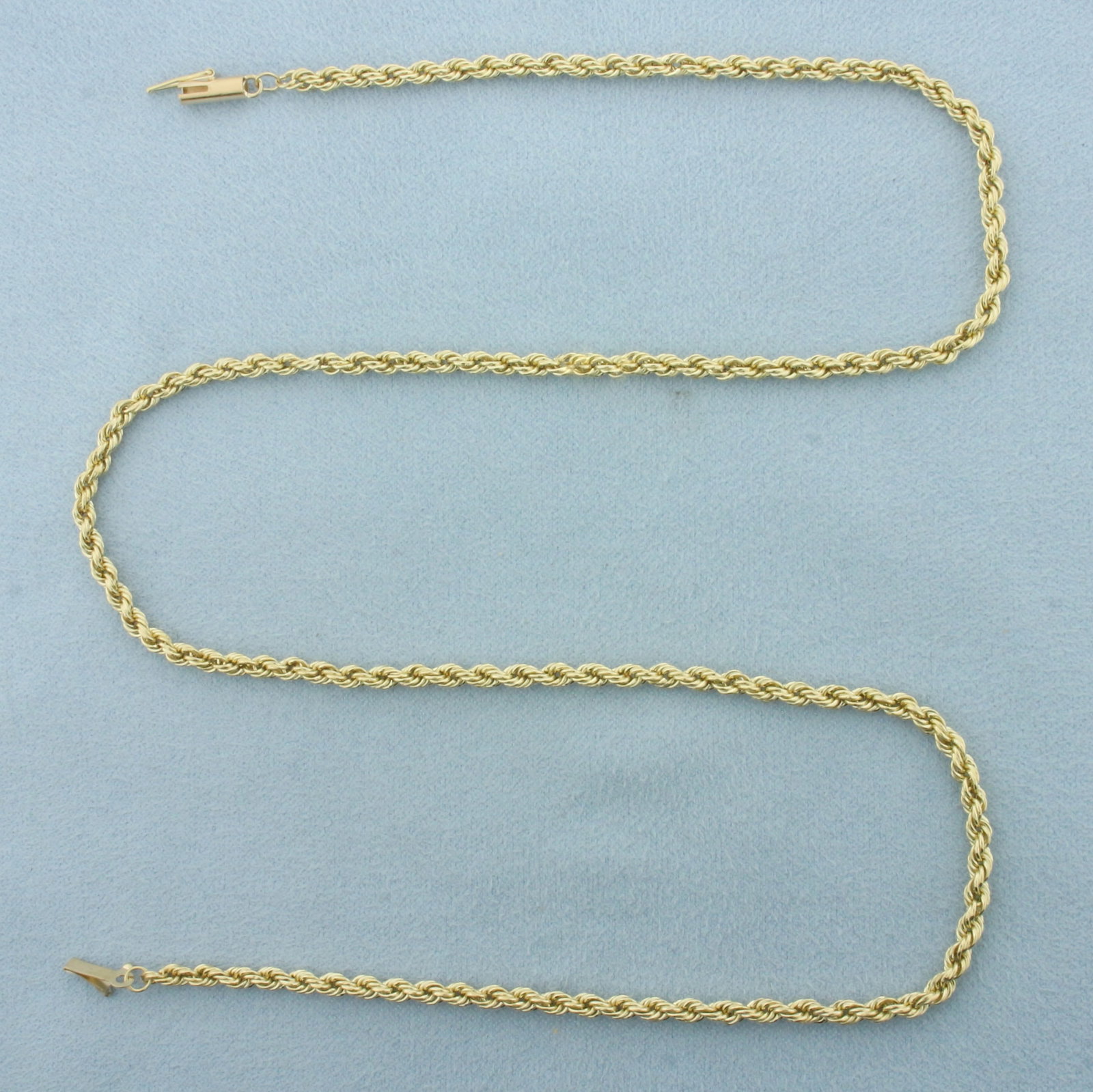 19 Inch Rope Link Chain Necklace in 14k Yellow Gold: In 14k Yellow Gold. 19 inches long. 3mm wide. Barrel clasp with safety latch. 6.7g.