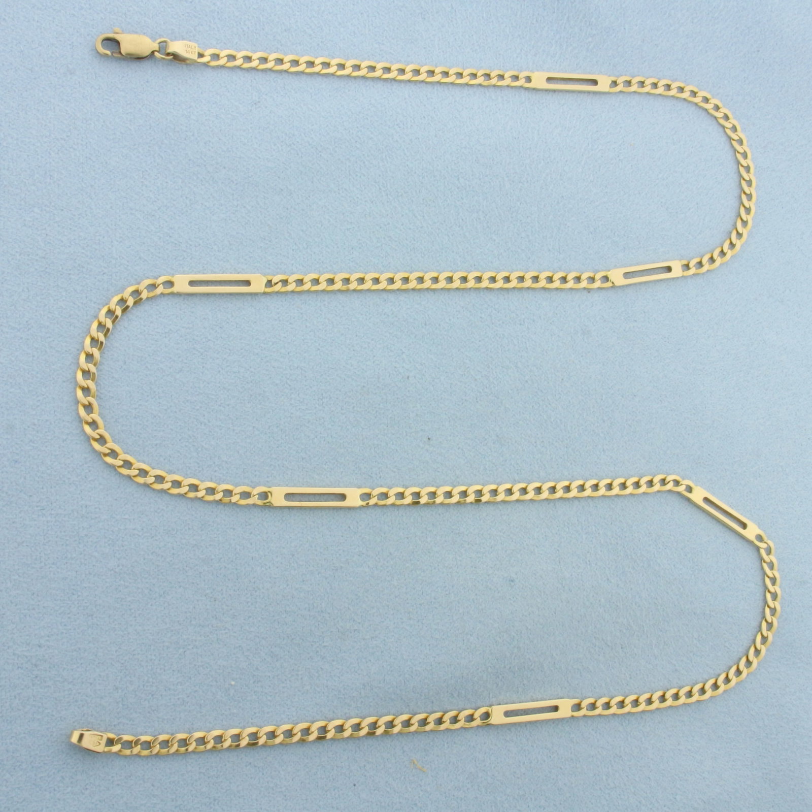 21 Inch Italian Curb Link Bar Chain in 14k Yellow Gold: In 14k Yellow Gold. 21 inches long. 3.2mm wide. Italian made. Lobster clasp. 10.8g.