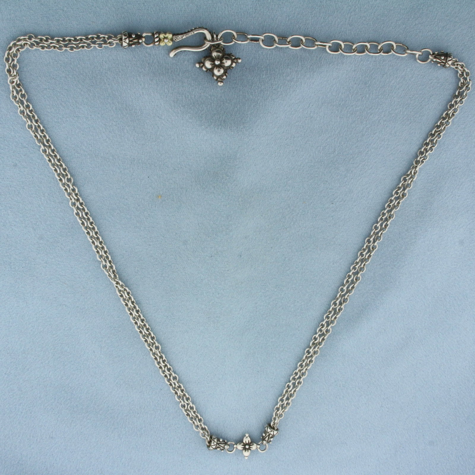 Barbara Bixby Flower Adjustable Double Chain in Sterling Silver and 18k Yellow Gold: In .925 Sterling Silver and 18k Yellow Gold. Adjustable from 15 3/4 inches to 18 3/4 inches long. 19.1g.