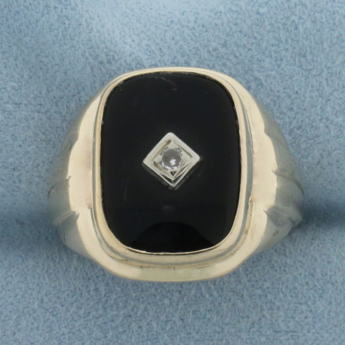 Mens Vintage Onyx And Diamond Signet Ring in 10K Yellow Gold: In 10k yellow gold. 18.4mm wide at top of ring. 15mm Onyx gemstone. Also contains one high quality .05ct diamond, VS clarity/H color. Size 9.25. 6.4g.