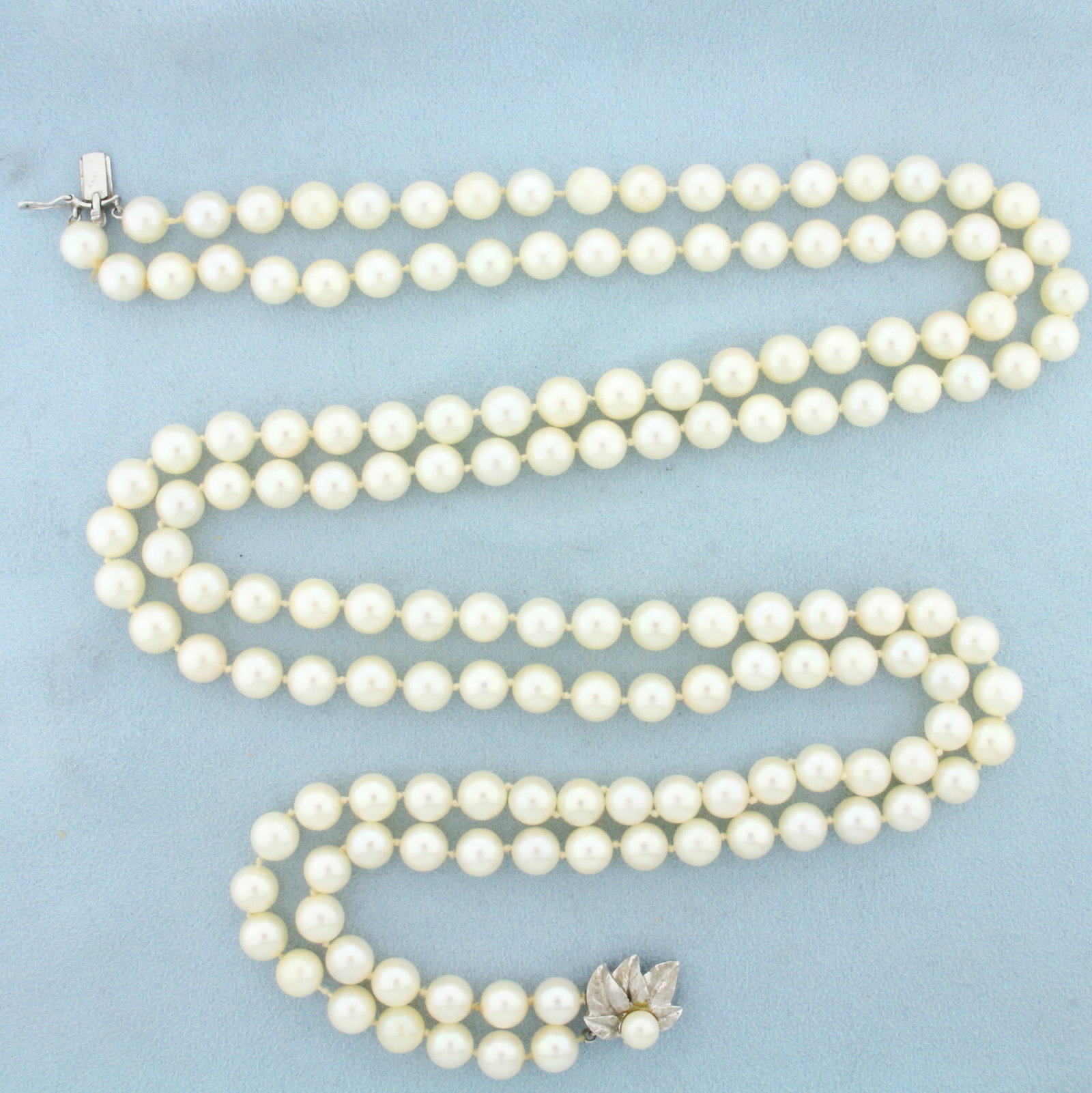Long 25 Inch Vintage Akoya Pearl Double Strand Necklace in 14K White Gold: 14k White Gold Clasp. Contains one hundred fifty two high quality 7.5mm Cultured Akoya Pearls with high luster. 25 inches long. 97.9g