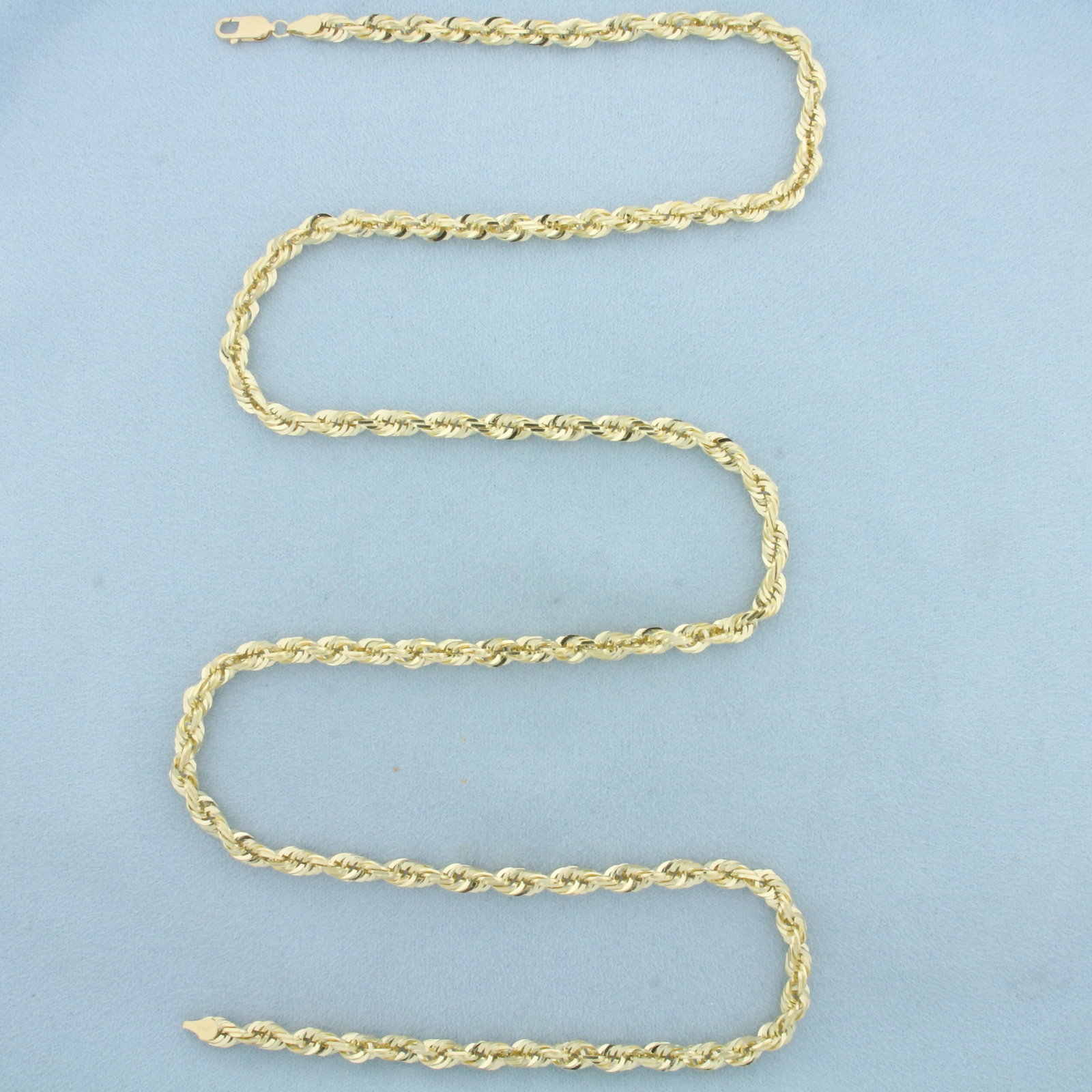 30 Inch Rope Link Chain Necklace in 10k Yellow Gold: In 10k Yellow Gold. 30 inches long. 5.1mm wide. Lobster clasp. 46.9g.