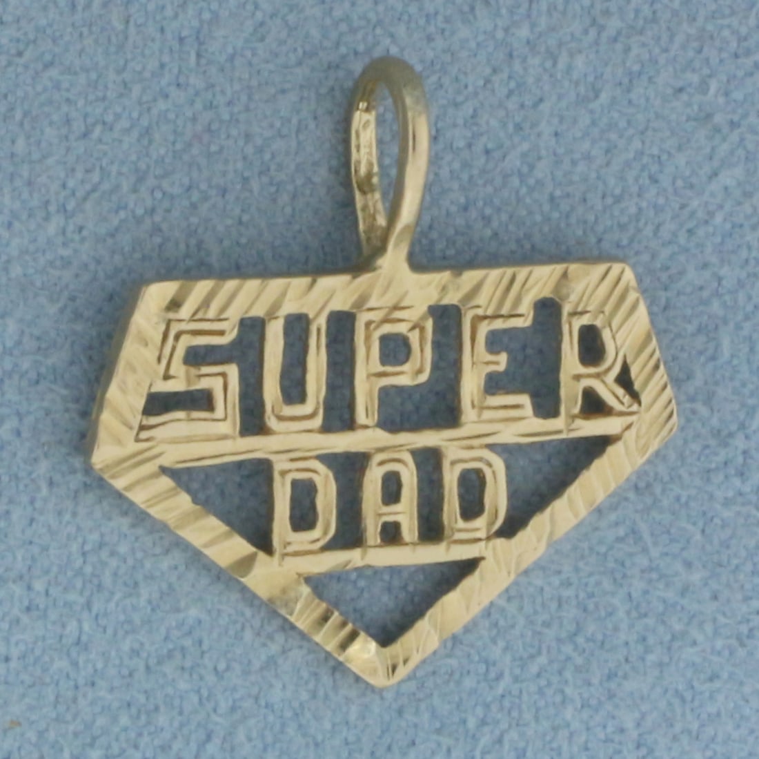 Super Dad Pendant in 14k Yellow Gold: In 14k Yellow Gold. 7/8 inch long (including bale). 7/8 inch wide. 1.2g.