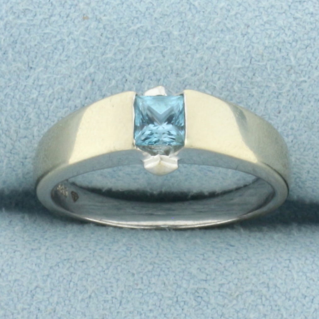 Tension Set Swiss Blue Topaz Ring In 14k White Gold: In 14k White Gold. Contain one 4mm 1/2ct high quality natural princess cut Swiss Blue Topaz gemstone with electric blue color and excellent clarity. Size 7.75.