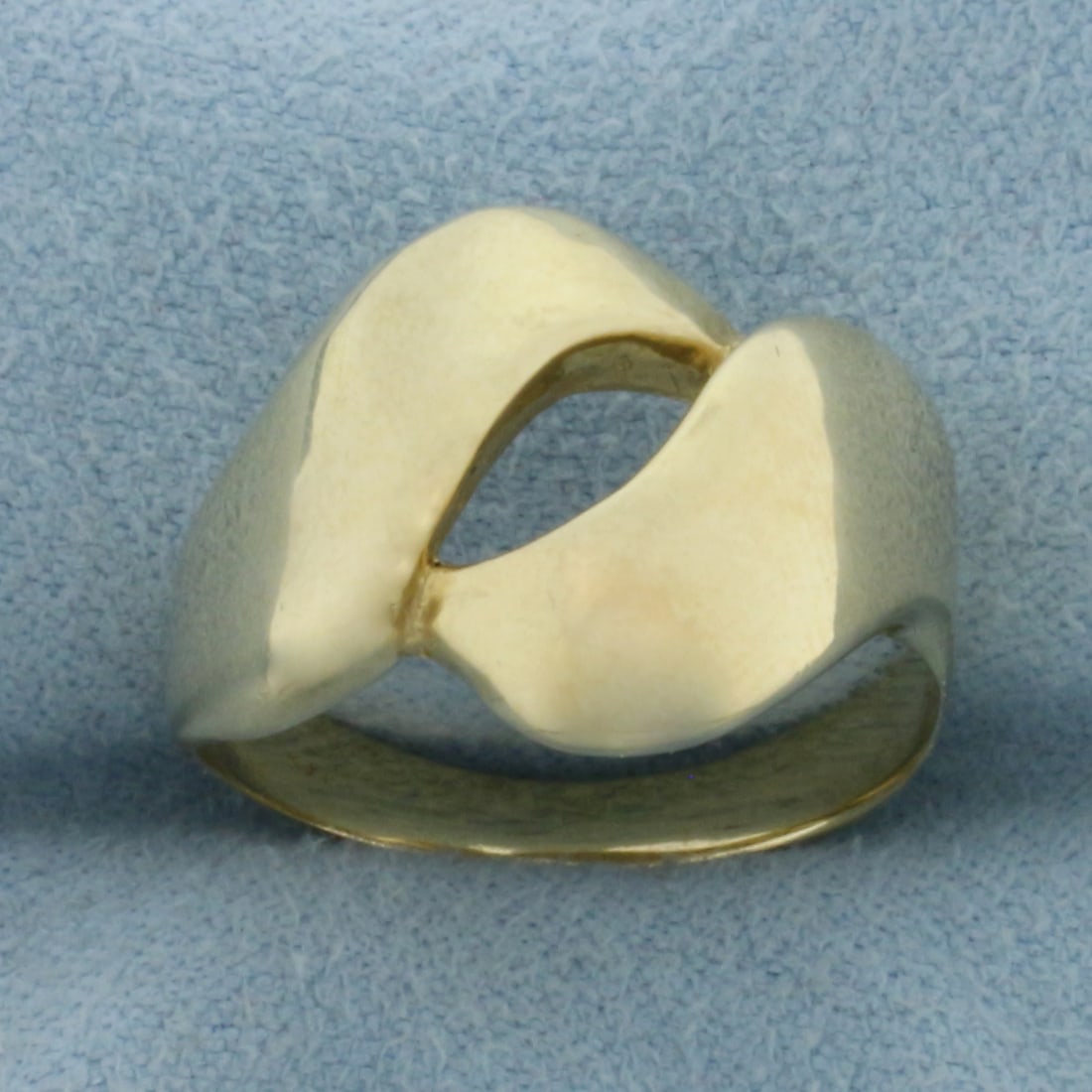 High Polish Abstract Design Ring in 14k Yellow Gold: In 14k Yellow Gold. 14mm wide at center. Size 8. 4.2g.