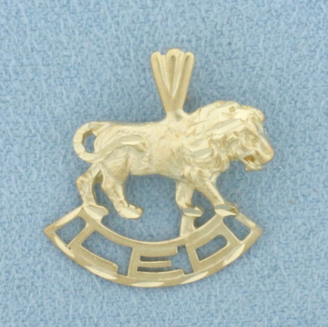 Leo Lion Zodiac Pendant in 14k Yellow Gold: In 14k Yellow Gold. 3/4 inch long (including bale). 5/8 inch wide. 1.9g.