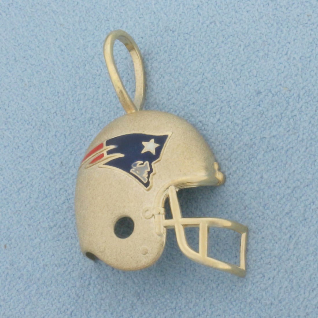 Vintage New England Patriots Football Helmet Pendant in 14k Yellow Gold: In 14k Yellow Gold. 1 1/4 inch long (including bale). 7/8 inch wide. Enamel details. 2.0g.