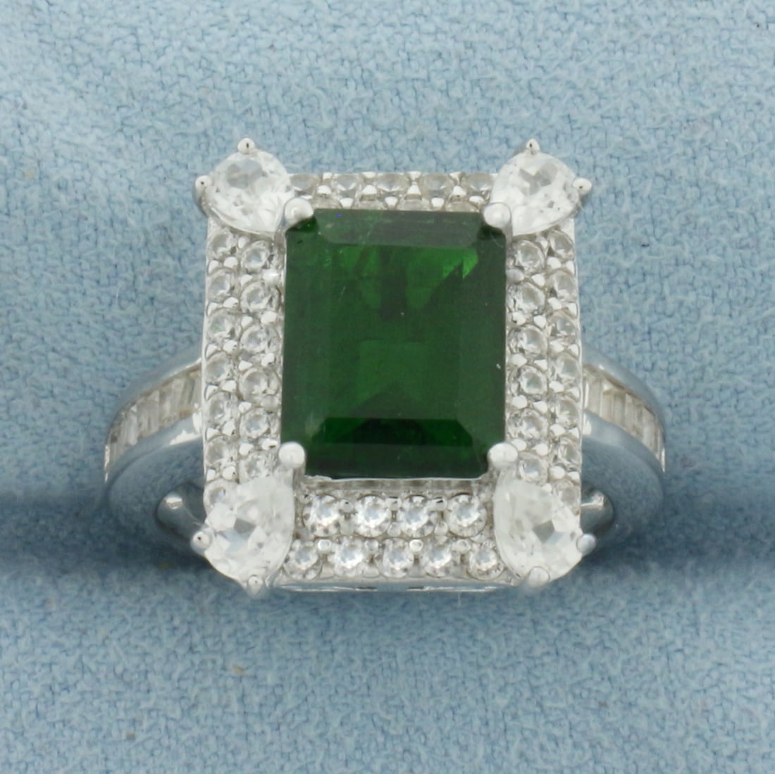 Russian Chrome Diopside and White Zircon Ring in Sterling Silver: In .925 Sterling Silver. Contains one 2.72ct high quality emerald cut Russian Chrome Diopside gemstone with intense color. Accented with 2.25ct TW of high quality White Zircon gemstones. Size 7.