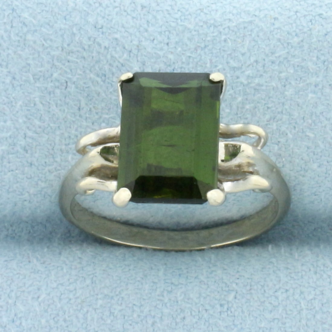 Tsavorite Solitaire Ring in 14k White Gold: In 14k white gold. Contains one high quality natural 4ct emerald cut Tsavorite Garnet gemstone with intense green color. Size 7. 3.9g.