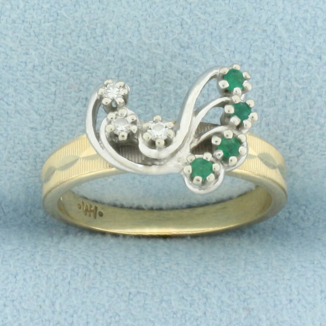 Emerald and Diamond Ring in 14k Yellow and White Gold: In 14k yellow and white gold. Contains four high quality natural Emerald gemstones, 1.75 to 2mm each, with intense color. Also contains three high quality .01ct diamonds, VS clarity/G color. Unique fi