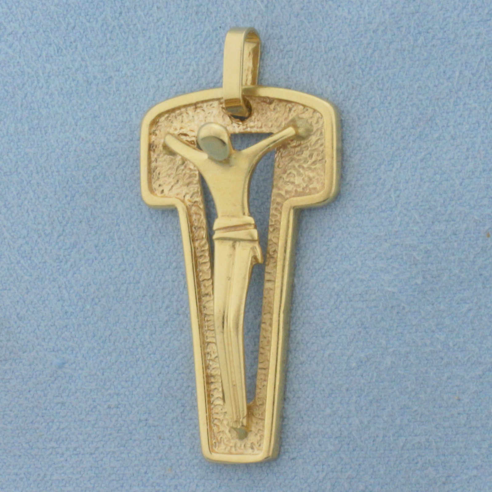 Modern Design Crucifix Cross Pendant in 18k Yellow Gold: In 18k Yellow Gold. 1 5/8 inch long (including bale). 3/4 inch wide. 6.4g.