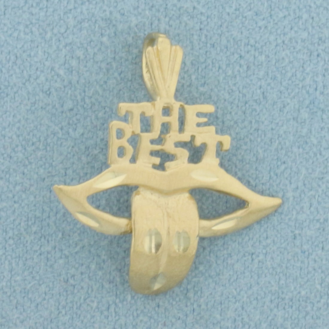 The Best Tongue Pendant in 14k Yellow Gold: In 14k Yellow Gold. 7/8 inch long (including bale). 7/8 inch wide at widest point. 1.4g.