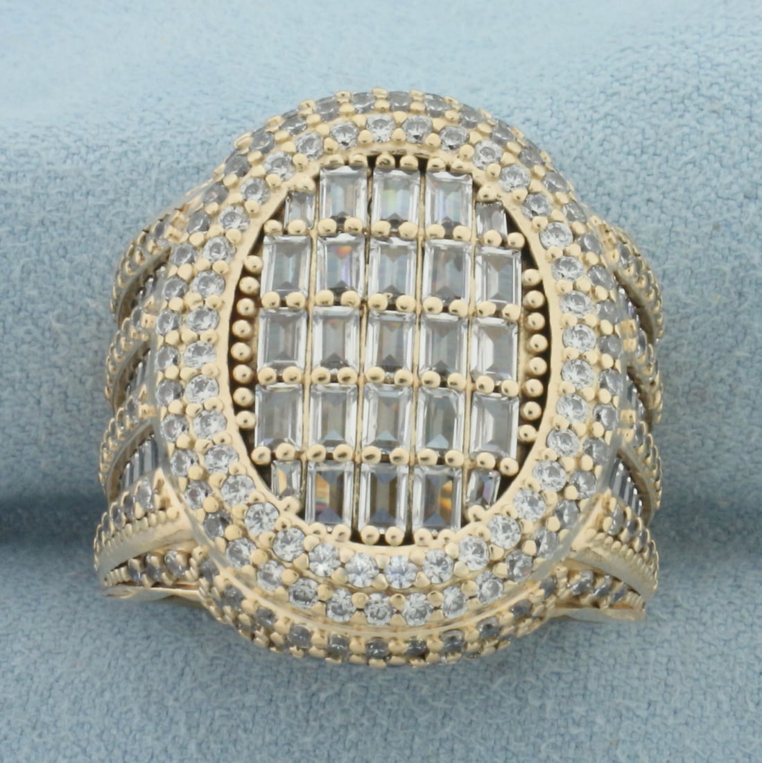Mens Emerald and Round Cut CZ Statement Ring in 14k Yellow Gold: In 14k Yellow Gold. Contains Emerald and Round high quality CZ gemstones with excellent cut and clarity. 1 inch long at top center of ring. Size 11.5. 14.2g.