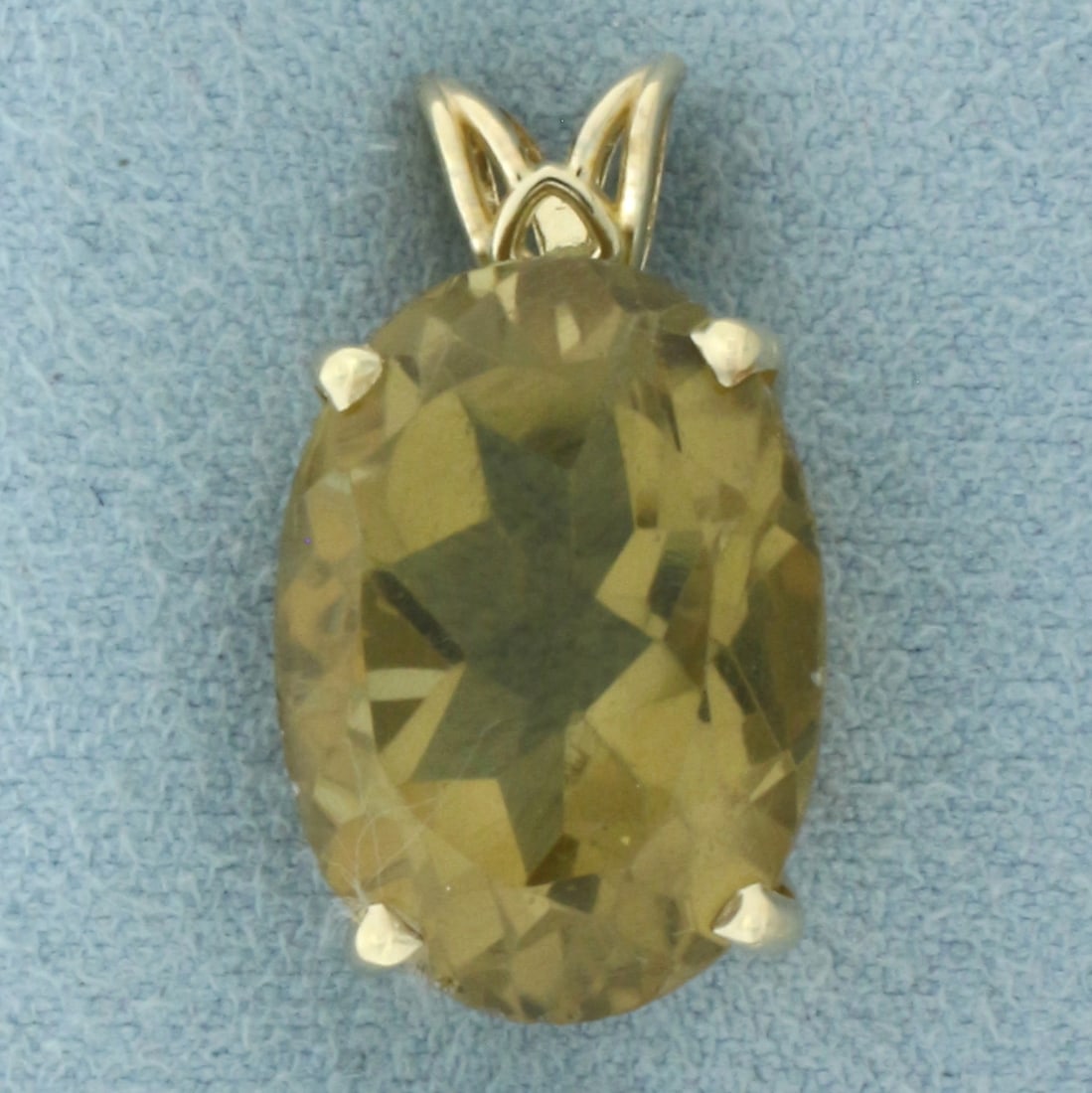 Large Citrine Solitaire Pendant in 14k Yellow Gold: In 14k Yellow Gold. Contains one 18x13mm high quality oval cut natural Citrine gemstone, approximately 12ct, with rich color and excellent clarity. 7/8 inch long. 1/2 inch wide. 4.7g.