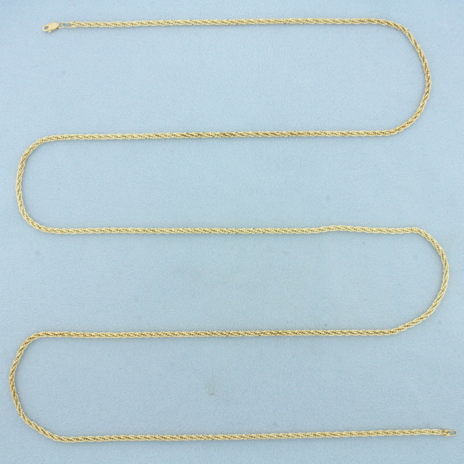 37 Inch Twisting Rope Link Chain Necklace in 14k Yellow Gold: In 14k Yellow Gold. 37 inches long. 2.2mm wide. Lobster clasp. 4.0g.