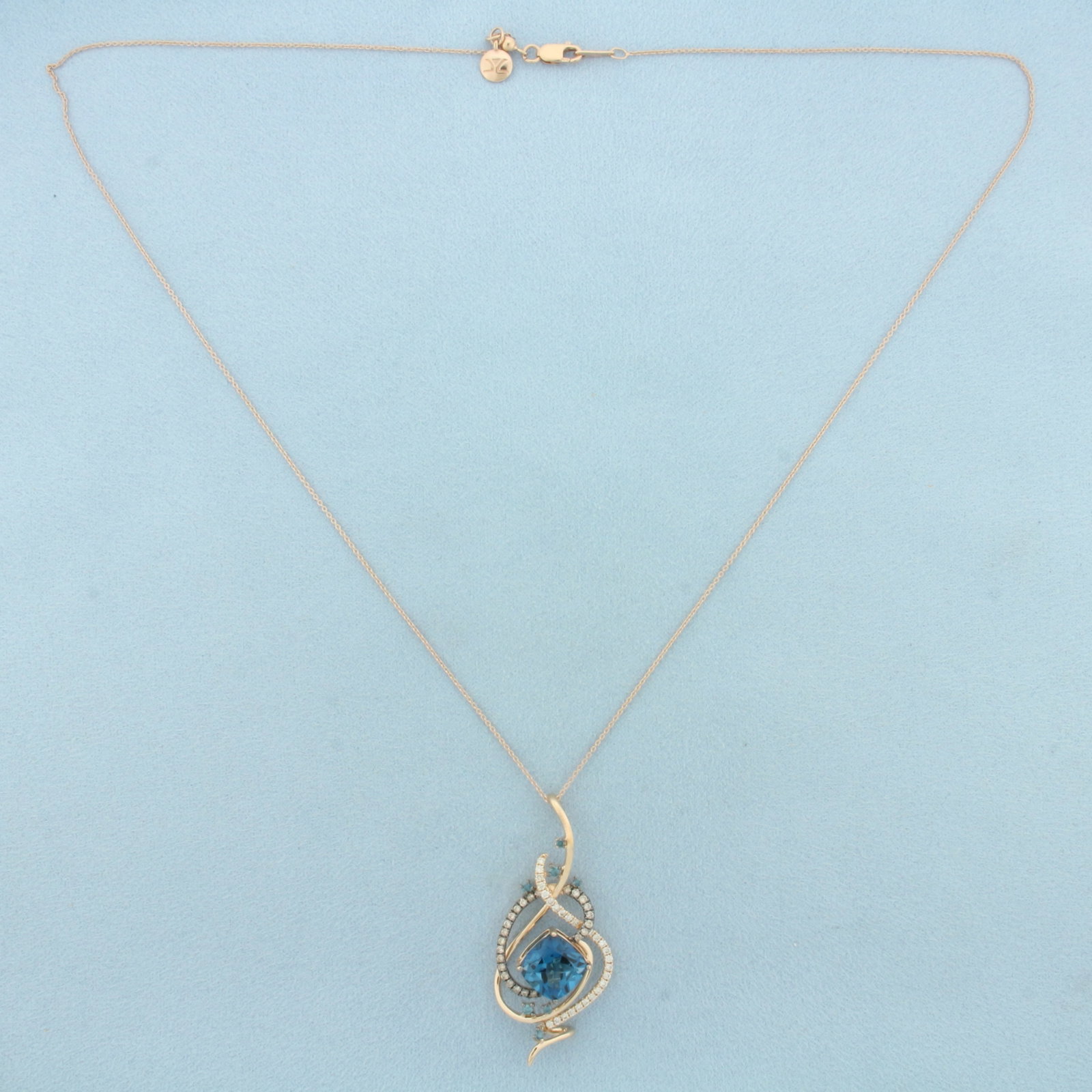 Levian Crazy Collection Deep Sea Blue Topaz and Diamond Necklace in 14k Rose Gold: In 14k Rose Gold. Contains one 10.1mm high quality cushion cut Deep Sea Blue Topaz gemstone, approximately 5cts, with intense color. Also contains seven high quality blue "blueberry" diamonds, 1/8ct T