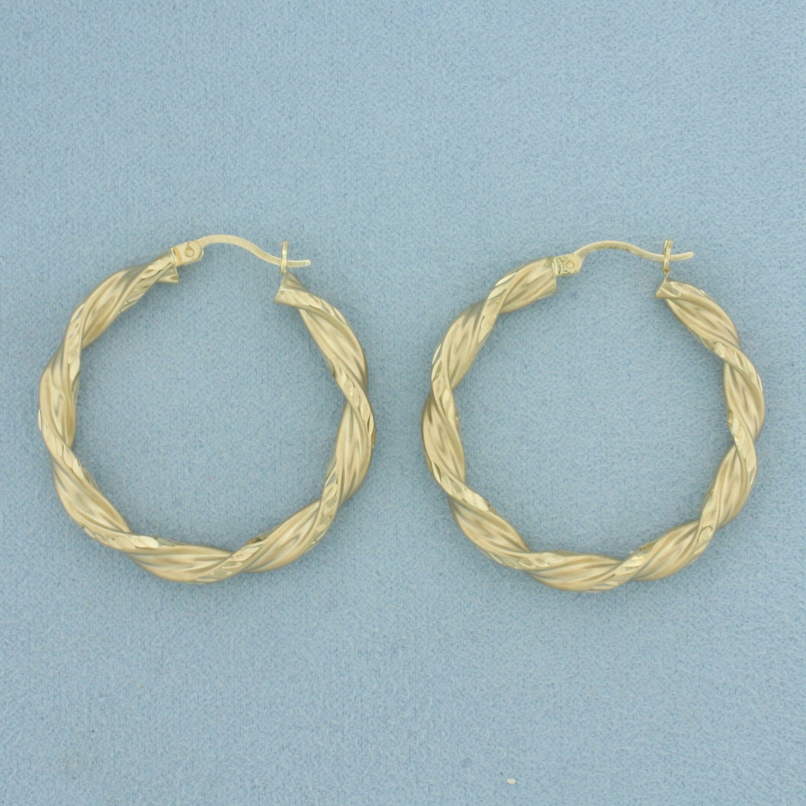 Twisting Desing Hoop Earrings in 10k Yellow Gold