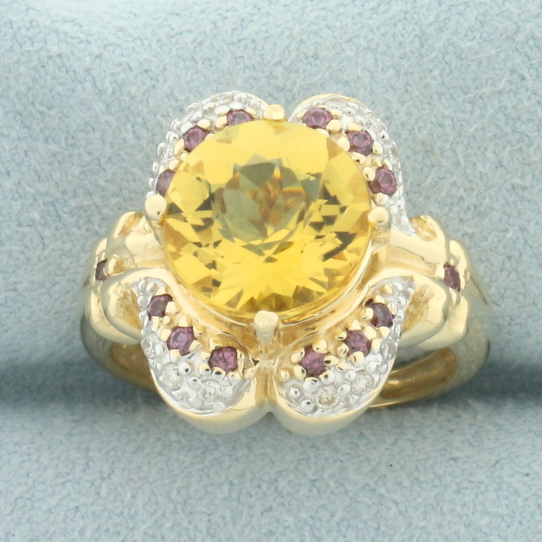 Citrine, Pink Sapphire, and Diamond Ring in 14k Yellow Gold: In 14k yellow gold. Contains 1 high quality natural 10mm citrine gemstone , approximately 3.3ct, with vibrant color and excellent clarity. Also contains 14 high quality natural 1.5mm pink sapphires wi